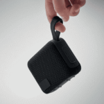 Portable Avaris RPET speaker on desk corporate gift